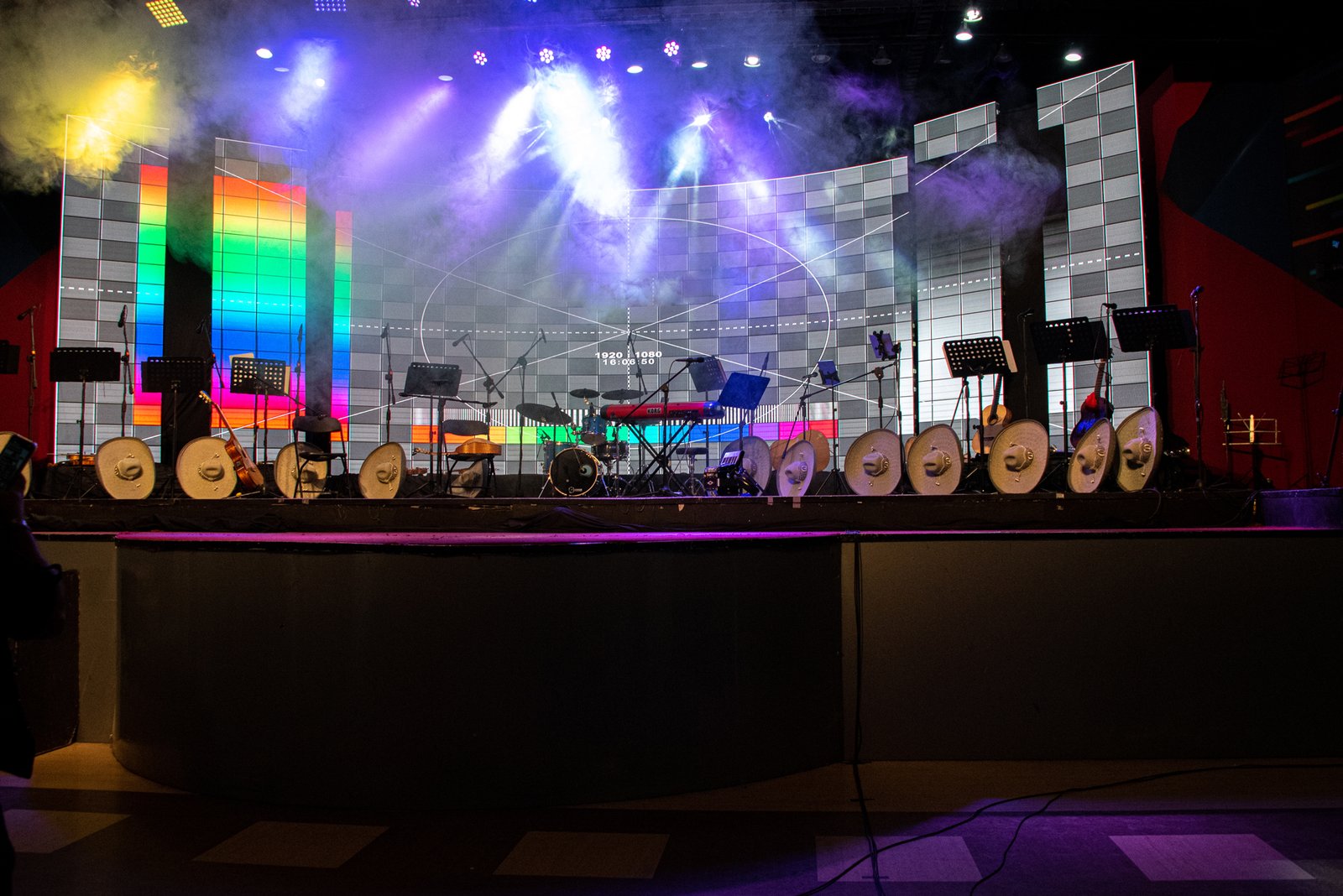 stage-setup-with-instruments-under-blue-lighting-2026-03-16-06-16-07-utc